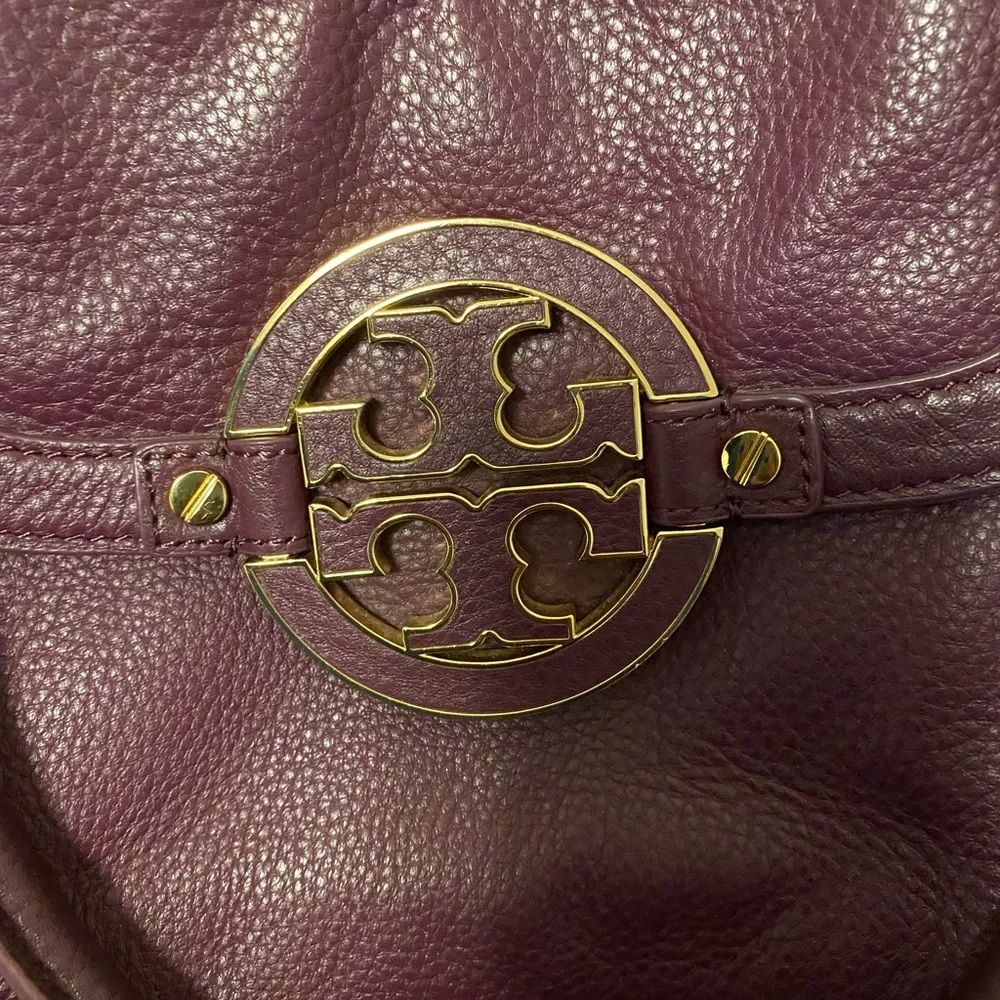 Tory Burch purple bag.